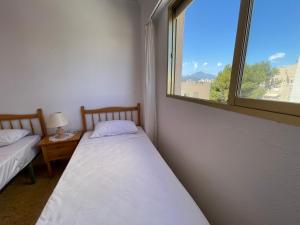 Łóżko lub łóżka w pokoju w obiekcie Apartamento en segunda linea en playa de Gandia
