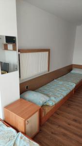 Ένα ή περισσότερα κρεβάτια σε δωμάτιο στο Pokoje Gościnne Róża