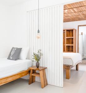 Ένα ή περισσότερα κρεβάτια σε δωμάτιο στο Cuatro Vientos Lodge & Apartments