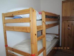 a couple of bunk beds in a room at Prinz-Hamlet-App-133-in-Pelzerhaken in Neustadt in Holstein