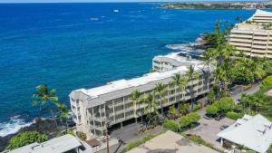 an aerial view of a building next to the ocean at Beautiful Oceanfront Welcomes you at Hale Kona Kai 203 by Casago Kona in Kailua-Kona