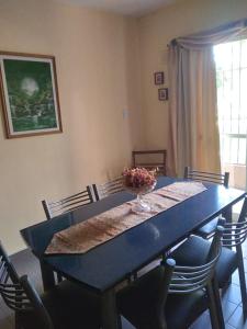 a dining room table with a bowl of fruit on it at Comodo Departamento in San Juan