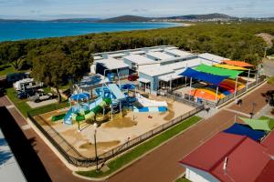 an aerial view of a park with a water park at BIG4 Emu Beach Holiday Park in Albany