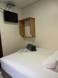 Cama o camas de una habitación en Hotel Carrão