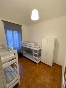 a room with two bunk beds and a window at Appartamento vicino centro in Turin