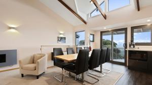 a dining room with a table and chairs at Snowtel 4 in Mount Hotham