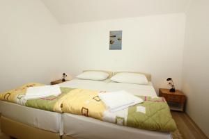 Postel nebo postele na pokoji v ubytování Apartments Vesna