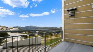 a balcony with a view of the mountains at Chalet Hotham 13 in Mount Hotham