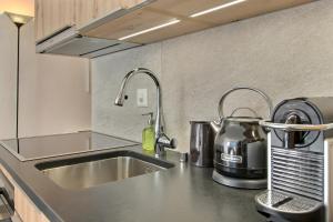 Kuchyň nebo kuchyňský kout v ubytování Small Space, Big Luxury