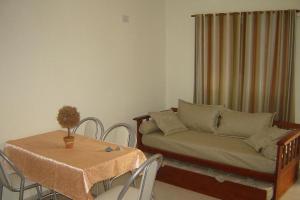 a living room with a couch and a table at Departamentos Donovan in Resistencia
