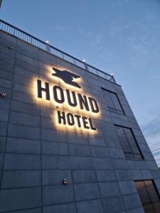 a hound hotel sign on the side of a building at Hound Hotel Songjeong in Busan