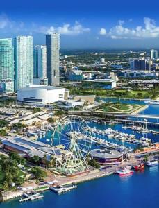 a city with a ferris wheel and a harbor at Home Sweet Home in Miami