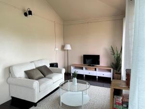 a living room with a couch and a coffee table at Zara Lodge in Bario