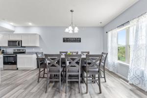 a kitchen and dining room with a table and chairs at Endless Summer condo in Branson West +46 photos