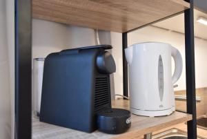 a appliance sitting on a shelf in a cabinet at Super central city appartement with free parking in Innsbruck