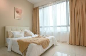 a bedroom with a bed with a large window at Greenfield Residence Bandar Sunway in Petaling Jaya
