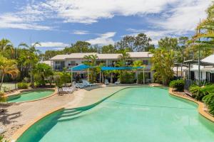 an image of a swimming pool at a resort at Sun Drenched Unit in Noosaville in Noosaville