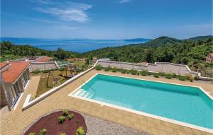 a swimming pool on top of a house at Amazing Home In Veprinac With 5 Bedrooms, Sauna And Wifi in Veprinac