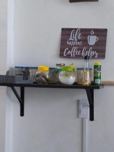a shelf on the wall with food on it at casa en playa santa clara yucatan in Santa Clara