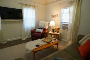 a living room with a couch and a table at 2 Bedroom Apartment near NDSU and Downtown Fargo in Fargo