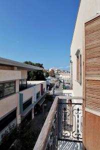 an apartment balcony with a view of a street at Flea Market 1BR - 30 09 Olei Zion St Tel Aviv in Tel Aviv