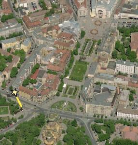 an aerial view of a city with a plane at Down Town Timisoara in Timişoara