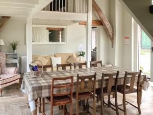 a dining room with a table and chairs at The Threshing Barn- 25347 in Findern