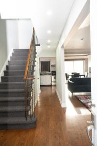 a staircase in a house with a living room at Nathan’s Place in Brampton