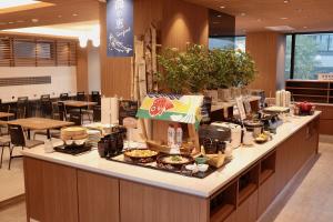 a buffet line with food on it in a restaurant at Sapporo Washington Hotel Plaza in Sapporo