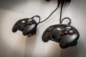 two black video game controllers hanging on a wall at Host & Stay - Knight St Place in Liverpool