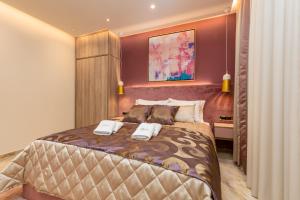 Postel nebo postele na pokoji v ubytování Hotel Vila Hedonija