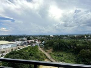 a view of a city from a balcony at Minimalist studio unit in Davao City