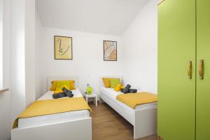 Postel nebo postele na pokoji v ubytování Luxury apartments Lotus&Lovor