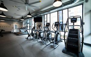 a gym with a bunch of exercise bikes and treadmills at Free parking Gym & Pool Downtown at CityWay in Indianapolis