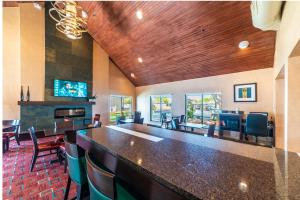 a large room with a bar and chairs at Metro PHX downstairs STUDIO sleeps 4 ADA Accessible in Phoenix