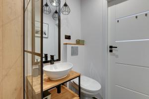 O baie la Grand Apartments - Fala apartament na Przymorzu +8 fotografii