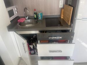 a small kitchen with a sink and a sink at Atico penthouse in Roquetas de Mar