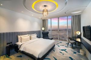 Postel nebo postele na pokoji v ubytování Regal Réseau Hotel & Spa