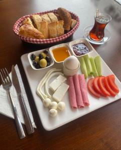 a tray of food with cheese and bread on a table at Ottoman Elegance Hotel in Istanbul