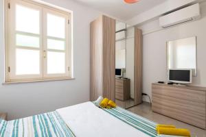 TV a/nebo společenská místnost v ubytování A Casa di Gi
