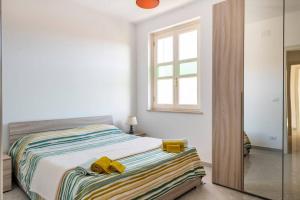 Postel nebo postele na pokoji v ubytování A Casa di Gi