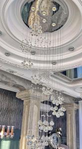 a bunch of chandeliers hanging from a ceiling at Vila Lemic Postojna in Postojna