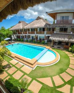 an aerial view of a resort with a swimming pool at Scent of Green Papaya in Panglao Island