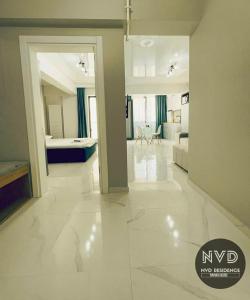 a large white room with a bedroom and a living room at NVD Residence Mamaia-NORD in Mamaia Sat/Năvodari