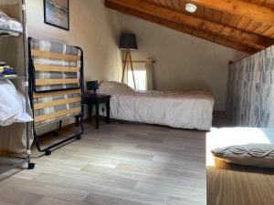 a bedroom with a bed and a desk in a room at Appartement à deux pas de la plage avec balcon-terrasse - FR-1-336-112 in Jard-sur-Mer