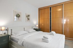 a bedroom with two beds with towels on them at Smart rooftop in Fuengirola Ref 212 in Fuengirola