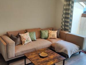 a living room with a couch and a coffee table at Beachgrove House in Bristol