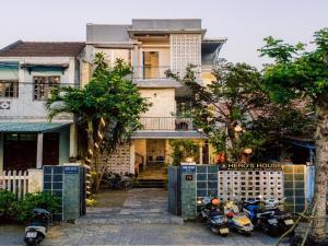 a group of motorcycles parked in front of a house at HA Hero Hoian Pool House in Hoi An