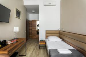 Ένα ή περισσότερα κρεβάτια σε δωμάτιο στο G12 Aparthotel