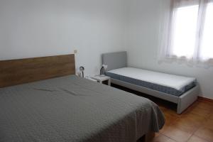 Кровать или кровати в номере Villa in Kalloni direkt am Meer, tolle Aussicht